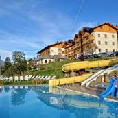 Wanderhotel - Freibad mit Wasserrutsche und Liegewiese - Hotel Glocknerhof