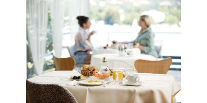Wanderurlaub - Verpflegung: Frühstück - Treffen (Treffen am Ossiacher See) - Frühstück mit regionalen und biologischen Produkten im Wintergarten am See - Boutiquehotel OGRIS AM SEE 