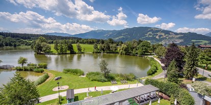 Wanderurlaub - Pools: Schwimmteich - Hochkönig - Ritzenhof private Liegewiese - Ritzenhof 4*s Hotel und Spa am See