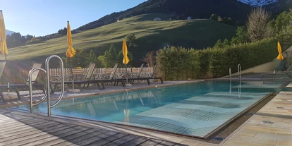 Wanderurlaub - Trockenraum - Trentino-Südtirol - Außenschwimmbad - Falkensteiner Hotel & Spa Sonnenparadies