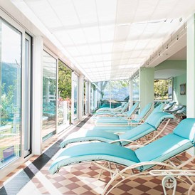 Wanderhotel: Ruhebereich mit Blick zum See - Seeglück Hotel Forelle