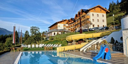 Wanderurlaub - Kärnten - Freibad mit Wasserrutsche und Liegewiese - Hotel Glocknerhof