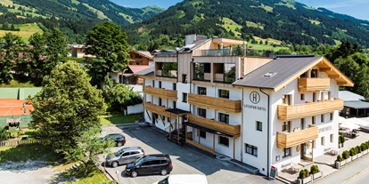 Wanderurlaub - Hotel-Schwerpunkt: Wandern & Biken - Tirol - Außenansicht Lifesporthotel Hechenmoos - im Herzen der Kitzbühler Alpen - Lifesporthotel Hechenmoos