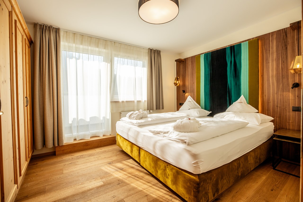 Moseralm Dolomiti Spa Resort Zimmerkategorien Suite Karersee mit Rosengarten Blick